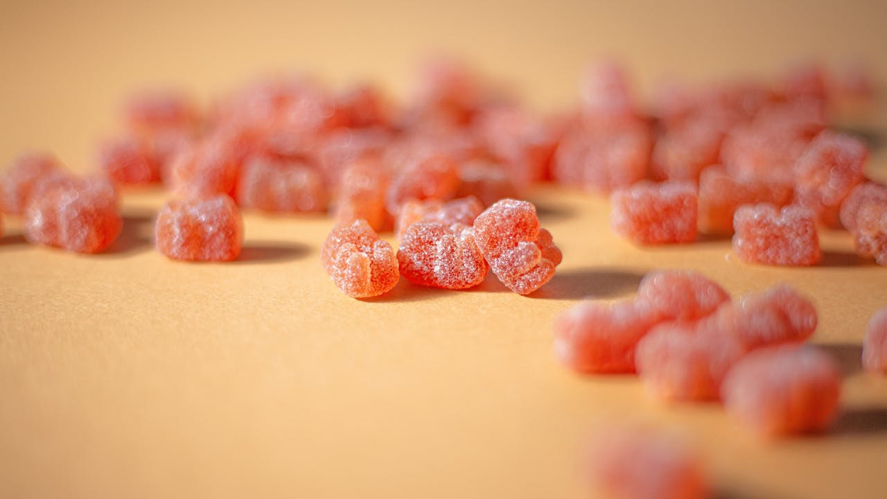 Gimmy vitamins spilled out on a surface 
